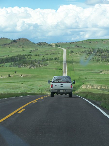 No 80 Following the leader, somewhere in Montana heading to our next campsite. It was so green on the trip, there had been about six weeks of rain before our arrival..JPG